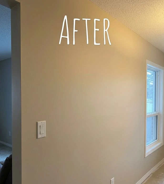 After: Freshly painted living room wall with smooth finish
